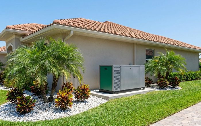 Generac standby generator installed on a concrete pad beside a Fort Myers home