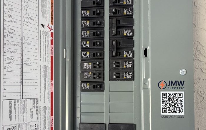 Electrical panel with a hand-labeled circuit directory and a JMW Electric sticker, Fort Myers