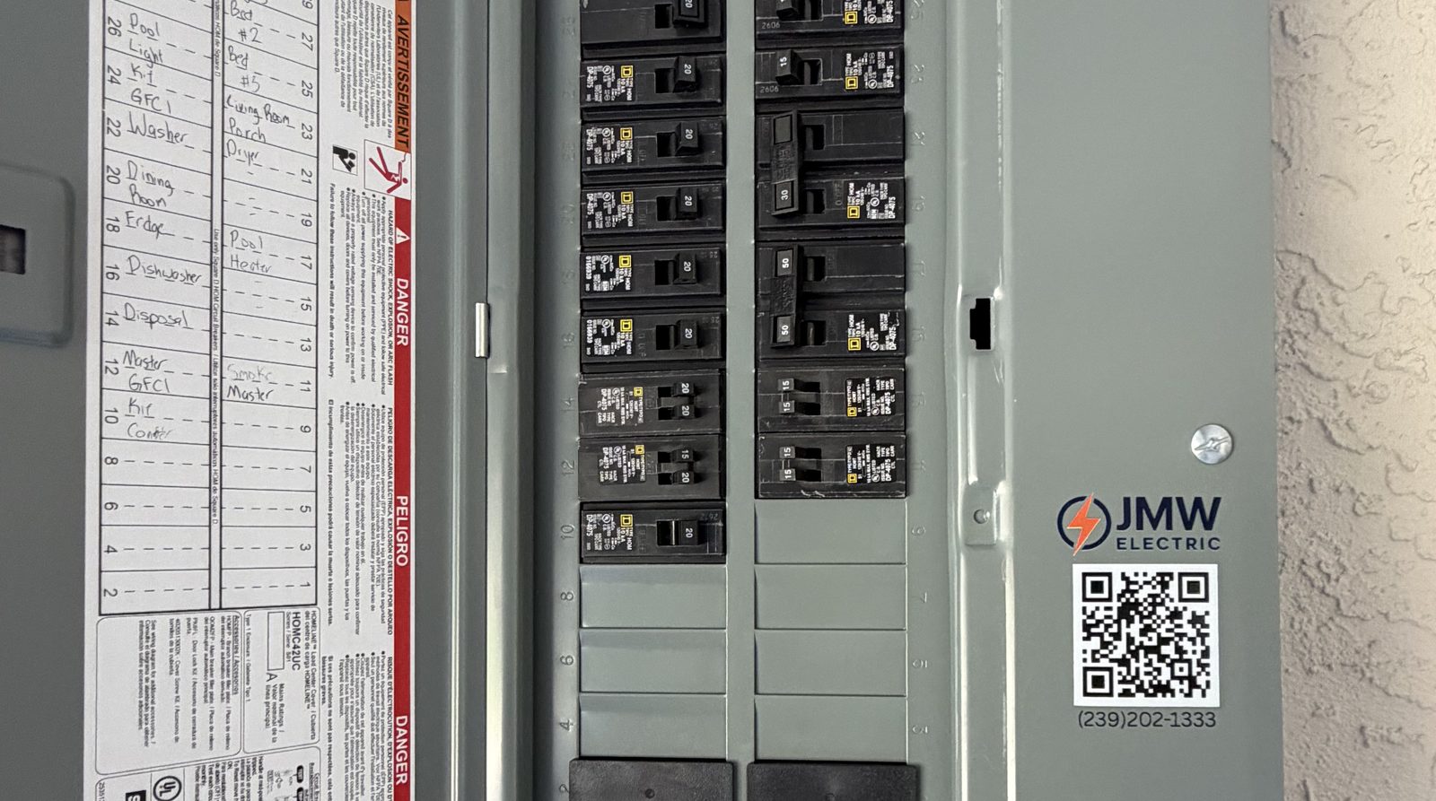 Electrical panel with a hand-labeled circuit directory and a JMW Electric sticker, Fort Myers