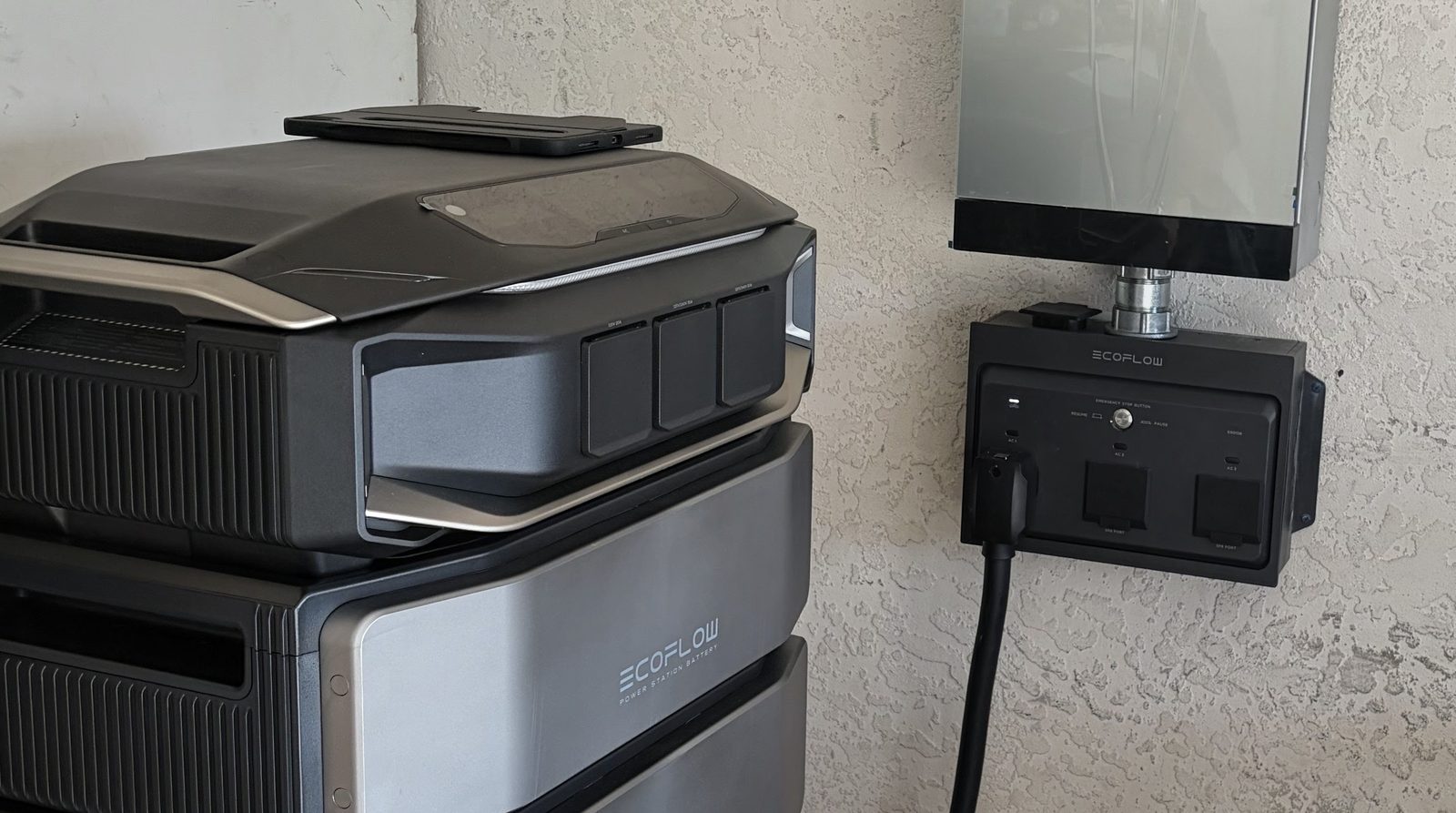 EcoFlow home battery backup stack wired to a wall-mounted EcoFlow connection box, Fort Myers